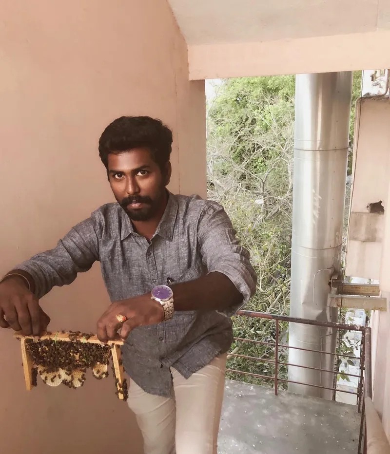 Kapildev Ganesan setting up the hives with our gobuzzr device