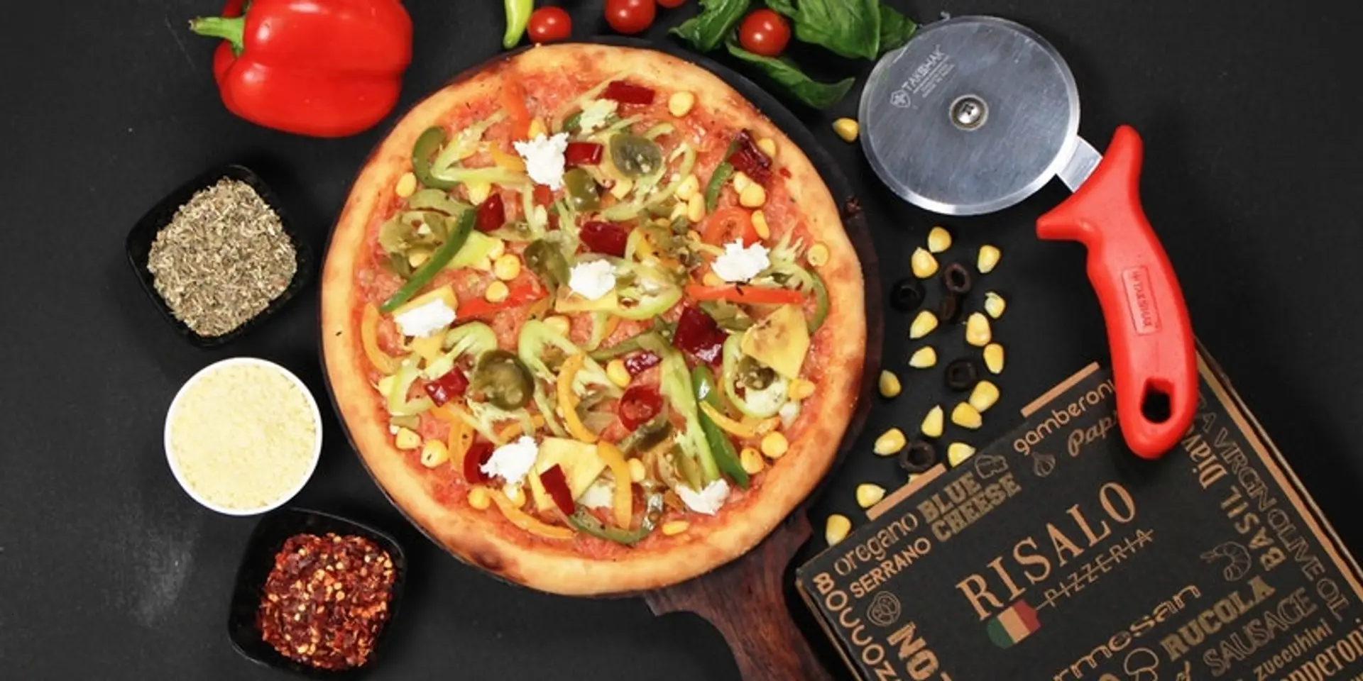 This Pizzeria started baking pizzas in brick oven at a car garage.