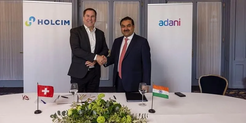 Adani group Chairman Gautam Adani (right) with Holcim CEO Jan Jenisch
