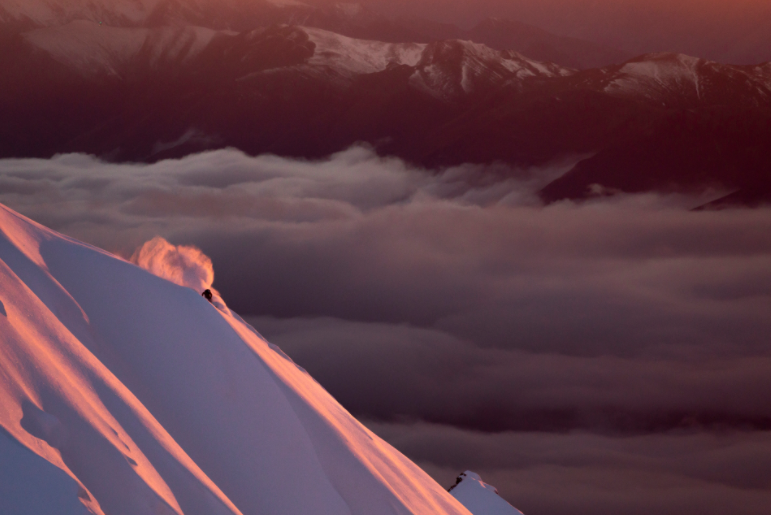 Fraser Mcdougall skiing first light at End Peak, Mt Aspiring National Park by Mark Clinton, Australia