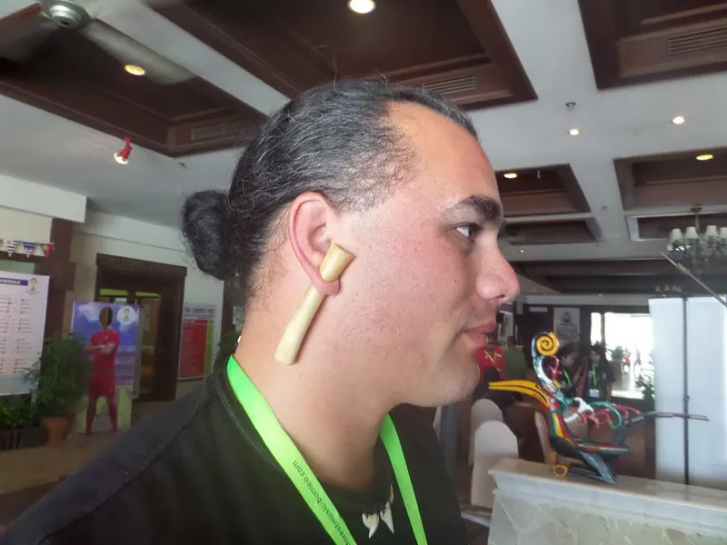 Maori instrumentalist Horomona Horo with the tiny koauau horn stuck in his pierced ear
