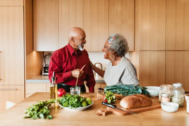 a happy couple making vegan food