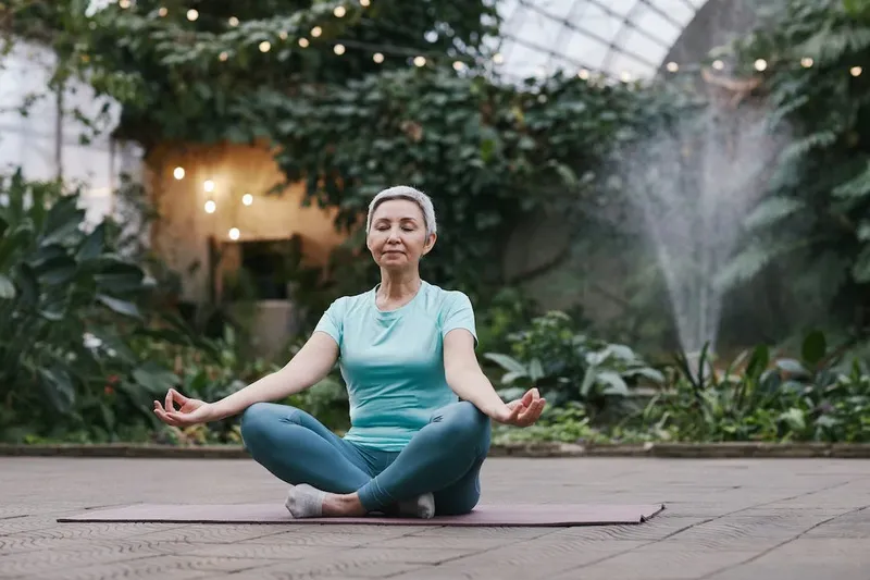 an old woman meditating 