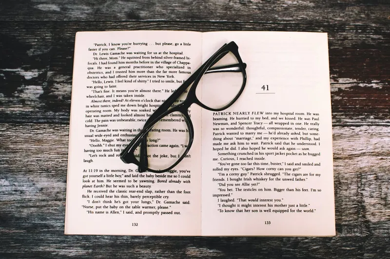 a pair of glasses on a book