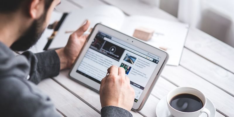 Man scrolling news websites