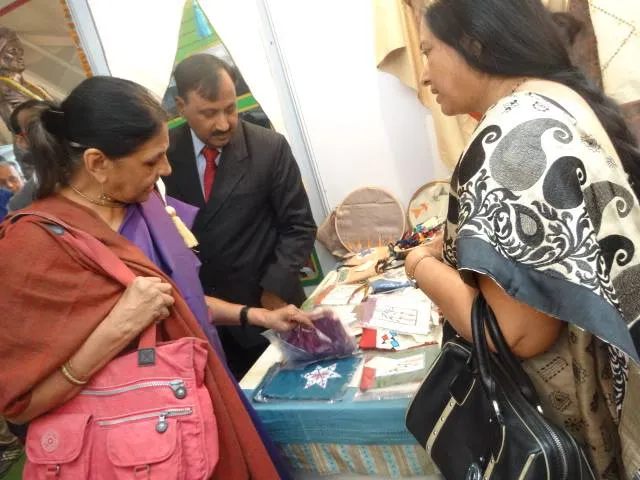 Suchitra Sinha showing handicrafts by Sabar people to Jaya Jaitly