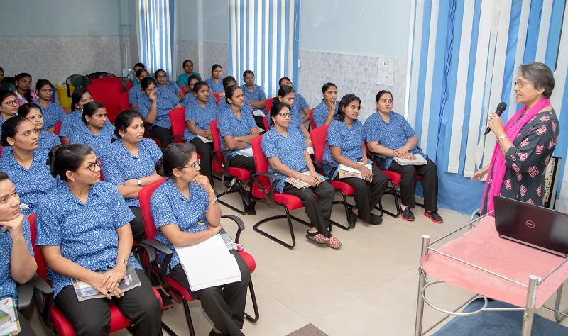 Dr Evita Fernandez with trainee nurses