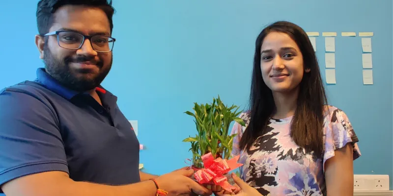 CEO Snehil gifts an employee a potted plant