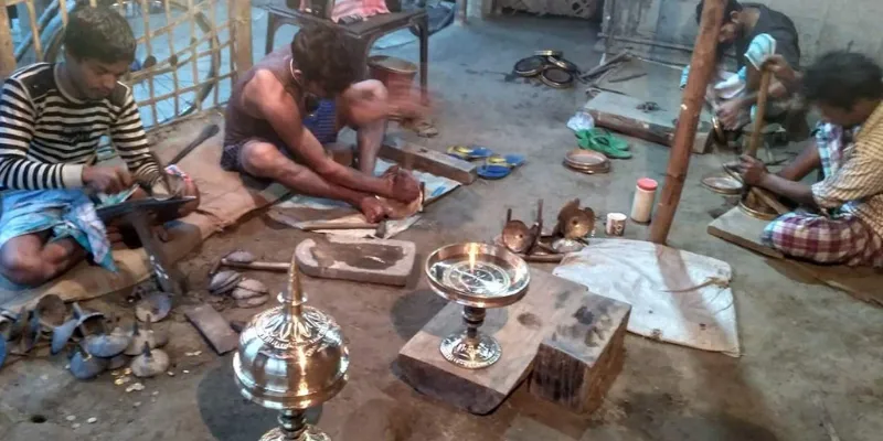 Bell metal workers in Assam