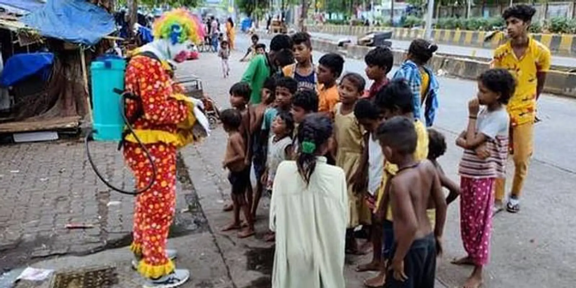 This social worker dresses up as a clown to spread awareness about COVID-19 among children in slums