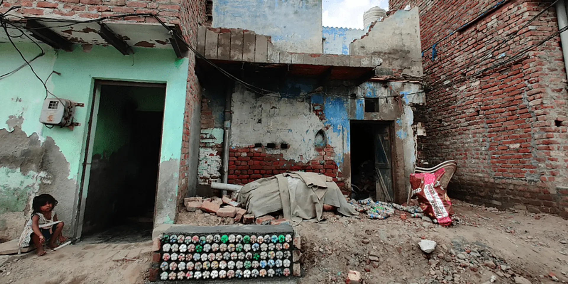 This community of children is recycling plastic into eco-bricks to build benches for their slum community