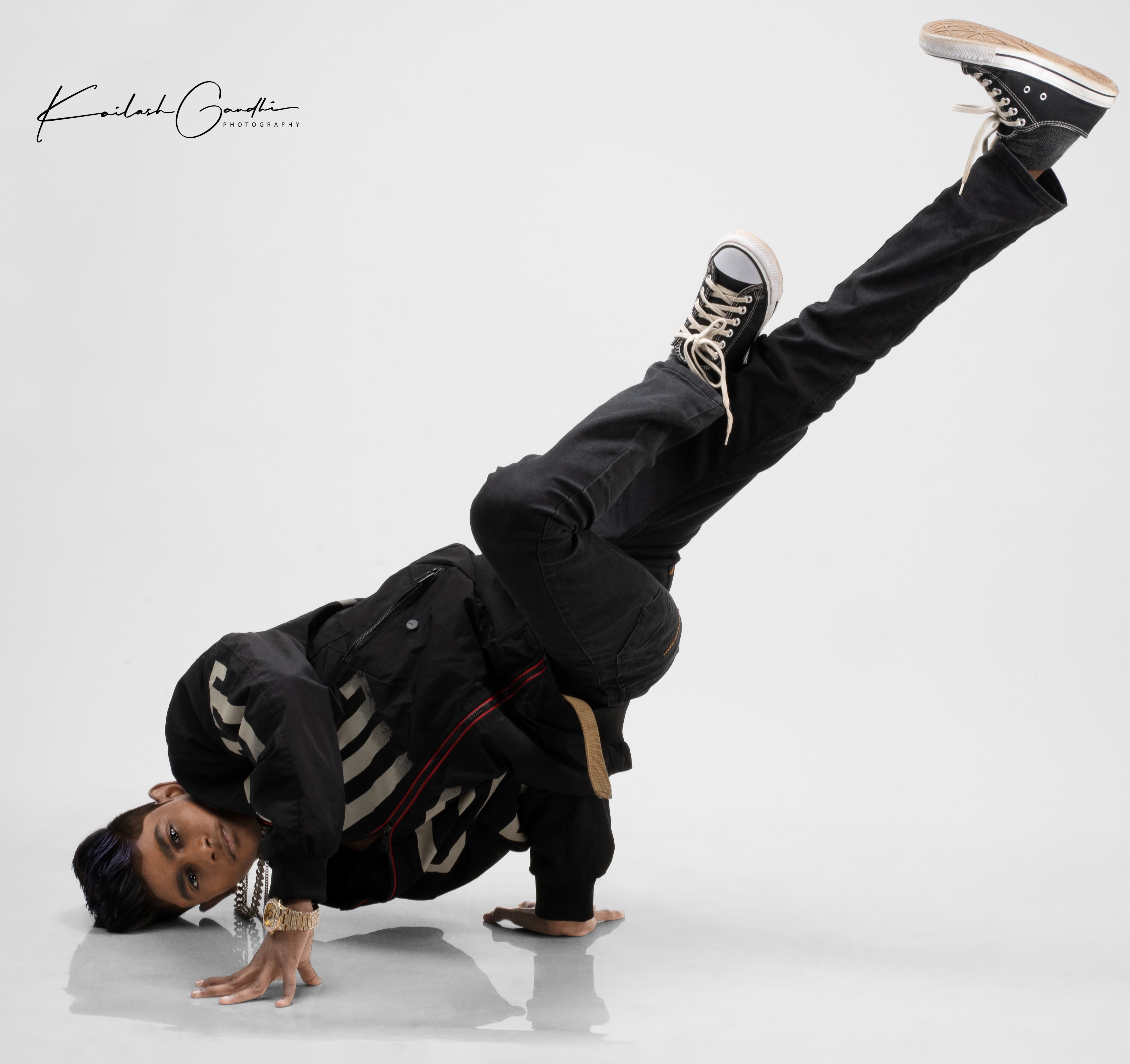 A Man Hip Hop Dancer or Bboy Freezes in One Pose on a White Background.  Bboy Doing Stylish Stunts. Stock Photo - Image of break, action: 186236660