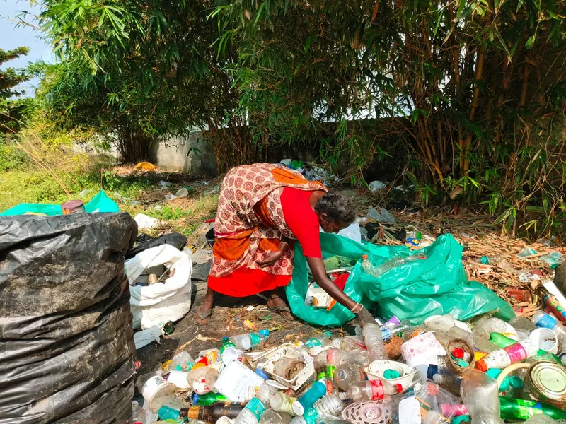 Manju, a single mother of two young children, sorts plastic bottles discarded by nearby hotels, resorts, and tourist attractions, earning around Rs 100 a day when work is steady.  She is one of the few people left behind at Manja Board without a roof over their heads.