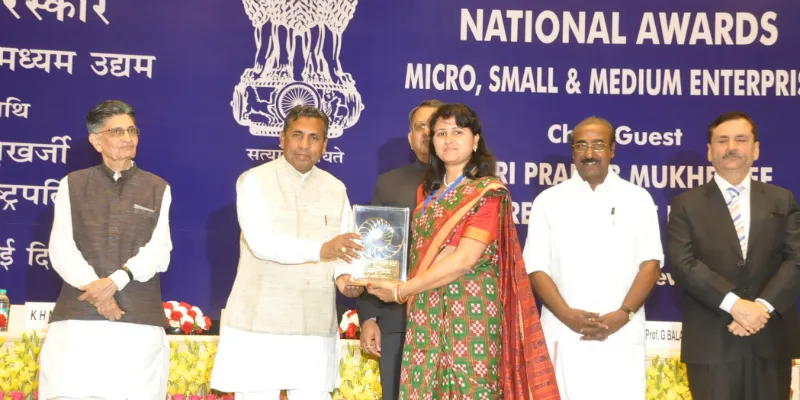 Banita Panigrahi receiving an award 