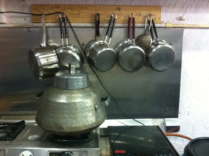 ‍The neatly-arranged pots and pan tell a happy tale.