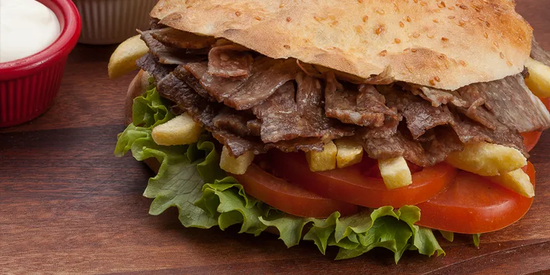 Thinly sliced meat packed into pita bread is very popular