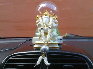 Most Indian cars have a deity on the dashboard or dangling from the mirror to ward off evil