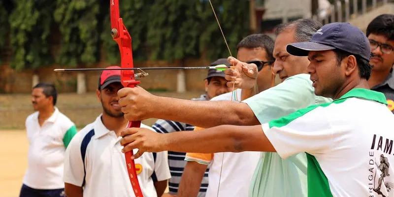 A Visually Challenged person trying  his hand at archery during one of the Giftabled events