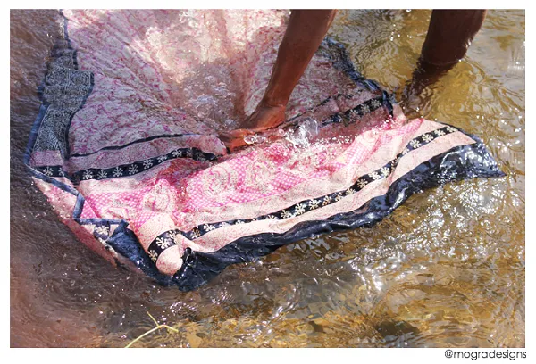 "As the excess color leaves the fabric in the river, the printing process reaches it's final leg and the fabrics are dried to reveal the beauty of this 1000 year old craft."