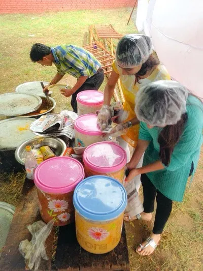 Volunteers collecting food from an event