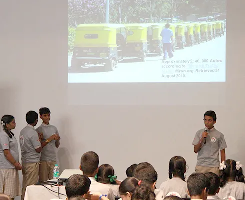 Children presenting their research papers