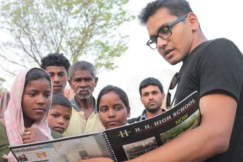 Shadab trying to convince villagers the benefits of learning.