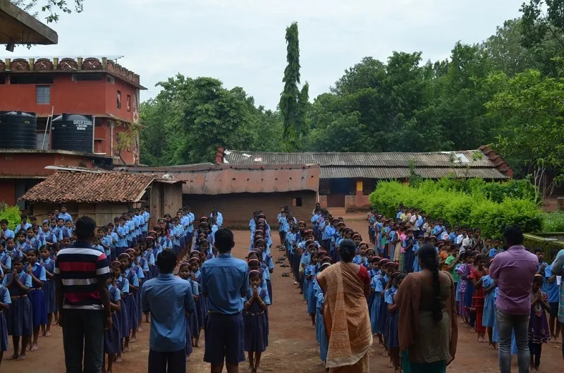 Students gather for the morning prayer at Shiksha Niketan School in Thuamulrampur, Odisha