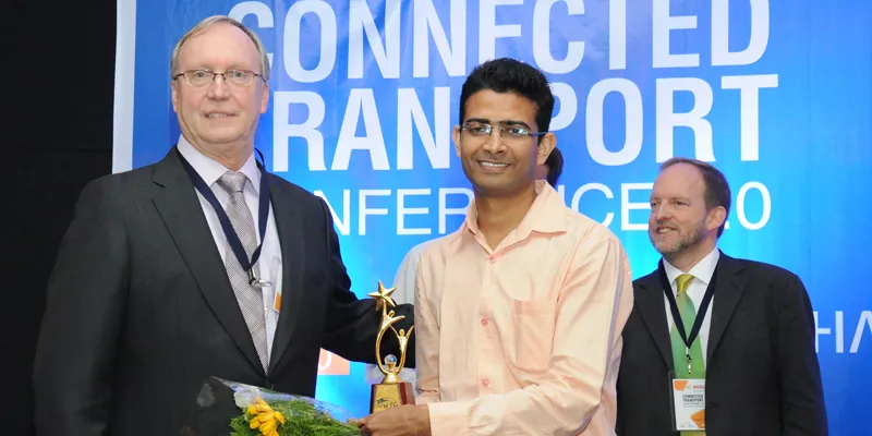 1st Winner - Haula Trucks, Sandeep Bhatia, presented the award by Scott McCormick, President of the Connected Vehicle Trade Association 
