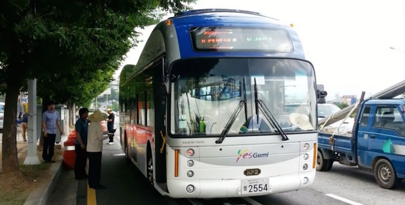 Electrically run buses to charge their batteries while on the move