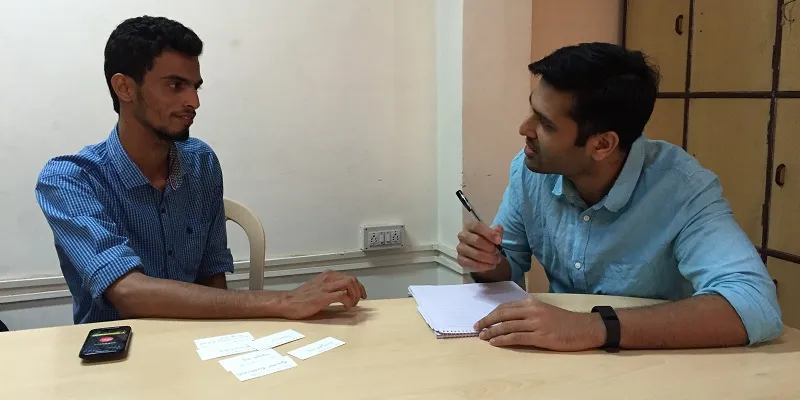 Madhav Krishna counseling and interviewing a student.