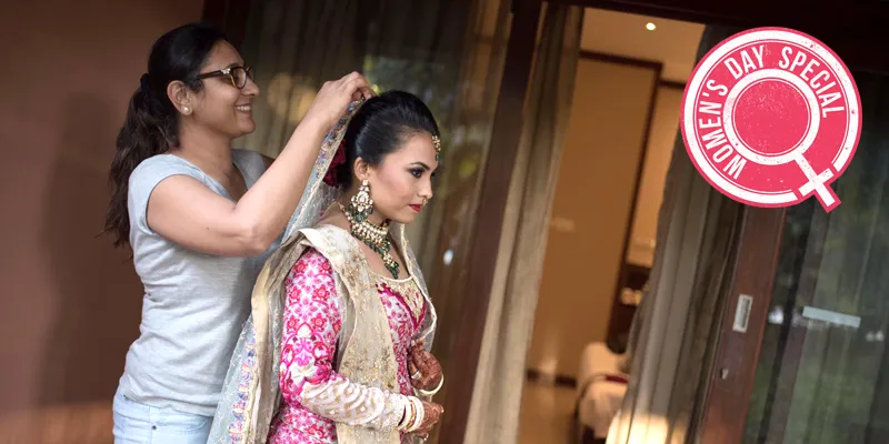 Roopali Agarwal adds the finishing touches to a beautiful bride's hairdo