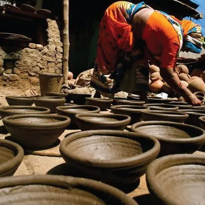 A woman engaging in pottery 