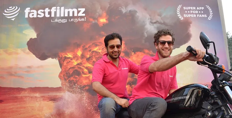 Founders of FastFilmz Karam Malhotra (riding pillion) and Dominic Charles