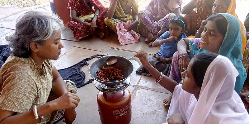 Aparna Pallavi cooking at a workshop for tribal women at a village near Udaipur in Rajasthan. 