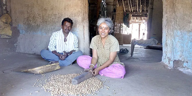 Aparna Pallavi learning to pound mahua flowers to make them food grade in Village Bhagpura in Khandwa, Madhya Pradesh.