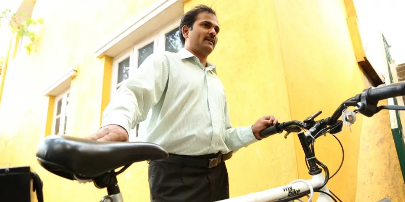 Muzzakir with his electronic bike
