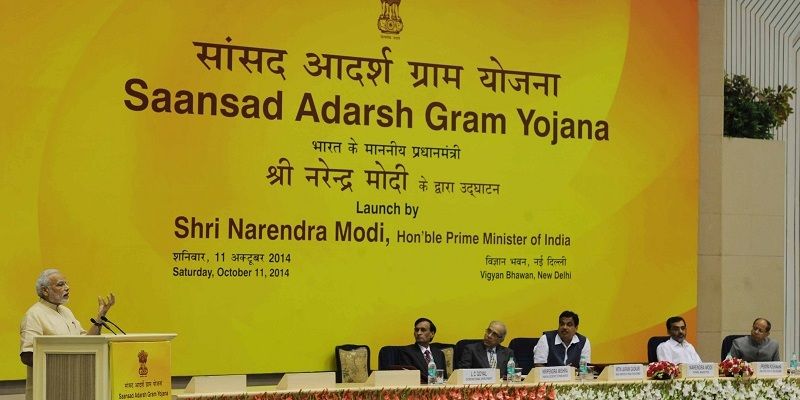 How has Saansad Adarsh Gram Yojana , Modi's project to resurrect villages, fared so far?