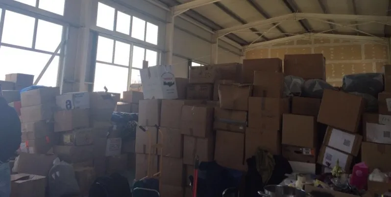 Boxes in a warehouse in Lesbos. StartupAid has created a database to understand what stock is available and can be requested by volunteers
