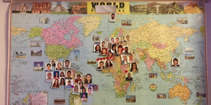 Image of the map with pictures of people who have lived in our intern house