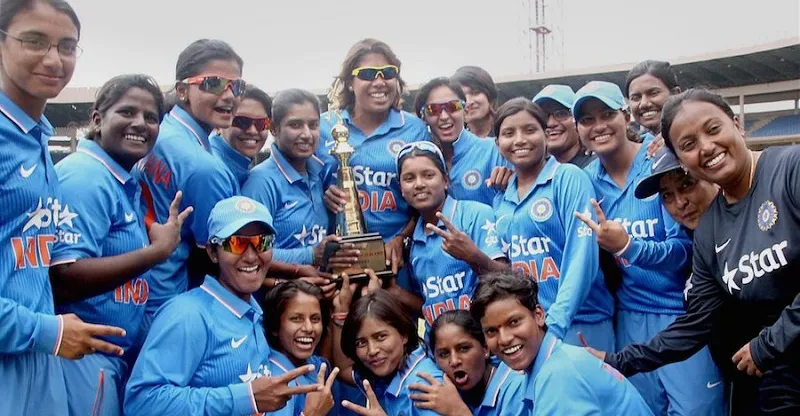 Indian women's cricket team celebrate with the trophy 