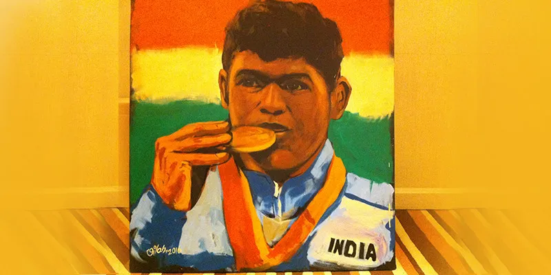 Vilas Nayak's completed portrait that he made of Mariyappan on the India Inclusion Summit stage.