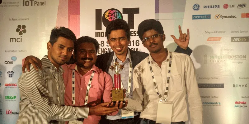 Ganesh with his team after winning the IoT startup award.