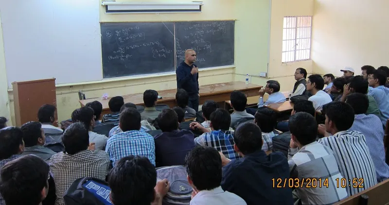 Amit speaking to students
