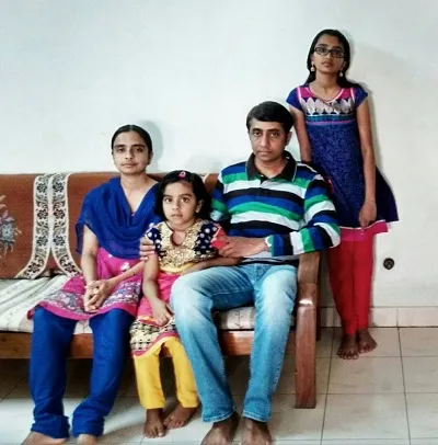 Leena with her husband and daughters