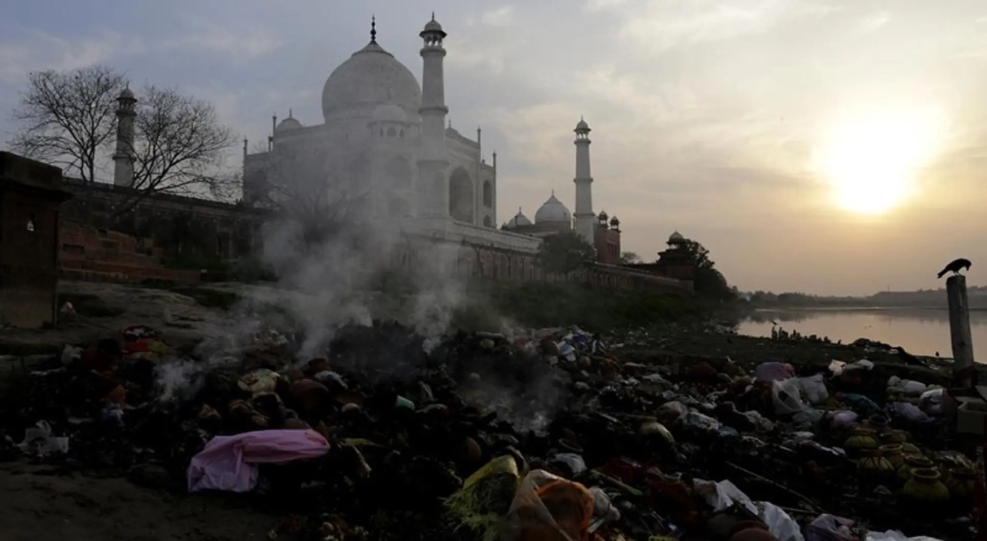 Cloaked in yellow pallor and green patches, Taj Mahal chokes in Agra air