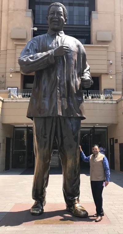 With Nelson Mandela statue