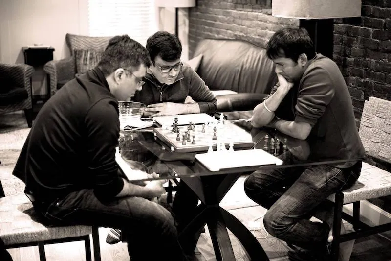 VIvek Vaidya playing chess with colleagues