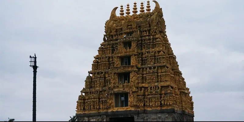 Photo #1: Belur is 17 kms away from Halebidu. As you approach the location, you can see an entrance gopuram painted yellow standing tall.