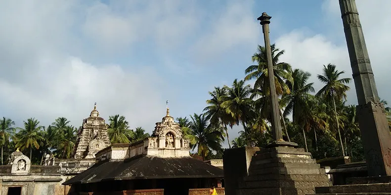 Figure 2 A saffron robed priest on his way to draw water, Madhukeshwara Temple
