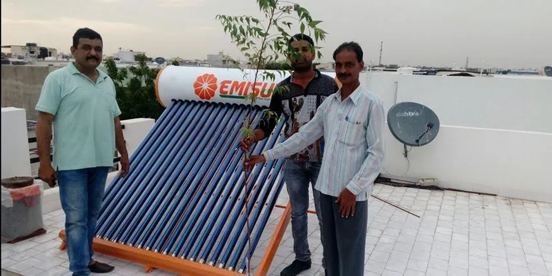 Gifting Plant sapling to our Client Shri. Ashwinbhai on installation of Solar Water Heater at his Residence in Gandhidham.